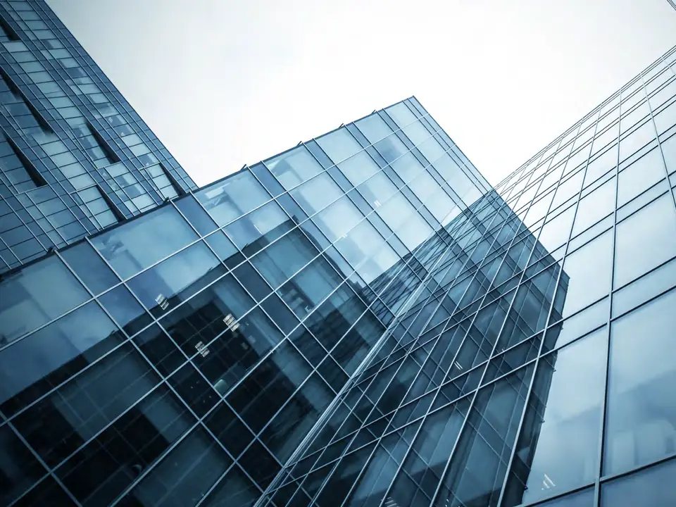 Glass office towers seen from below